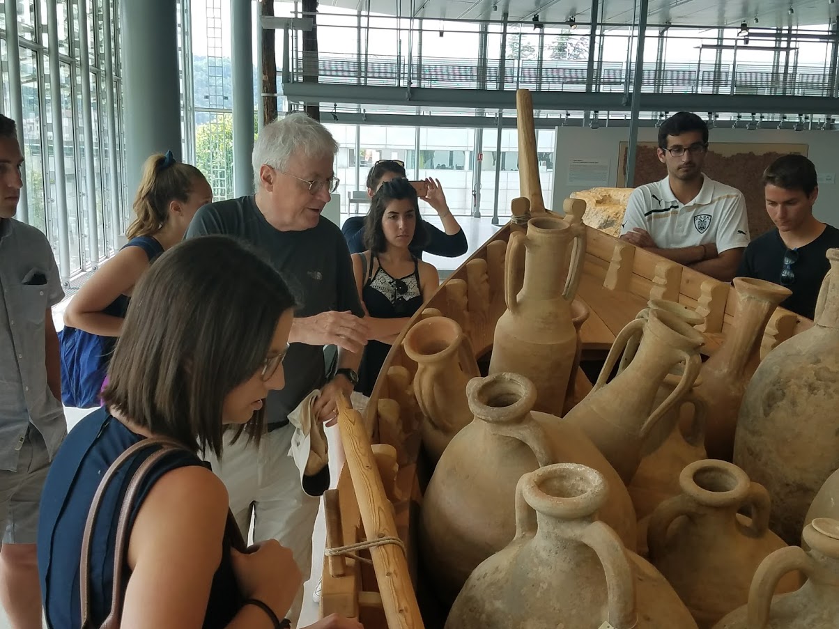 Students viewing Roman pottery with Prof. Hitchner