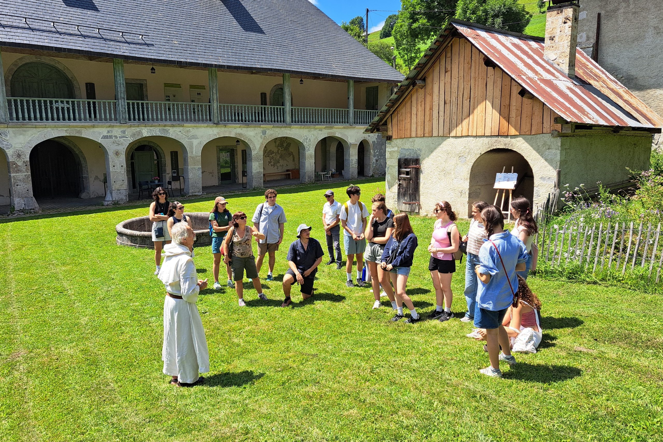 High School Tufts Summit students listen to their French instructor on a class excursion to Les Bauges in the Haute-Savoie in France.