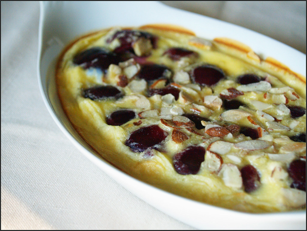 An image of the clafoutis cake, a vanilla base with cherries and almonds