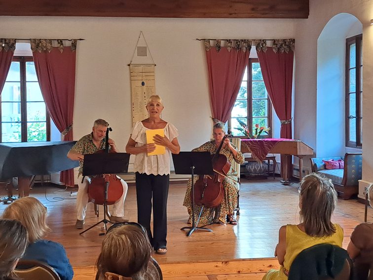 A singer and two cellist play music at the Priory in Talloires, the Tufts European Center.