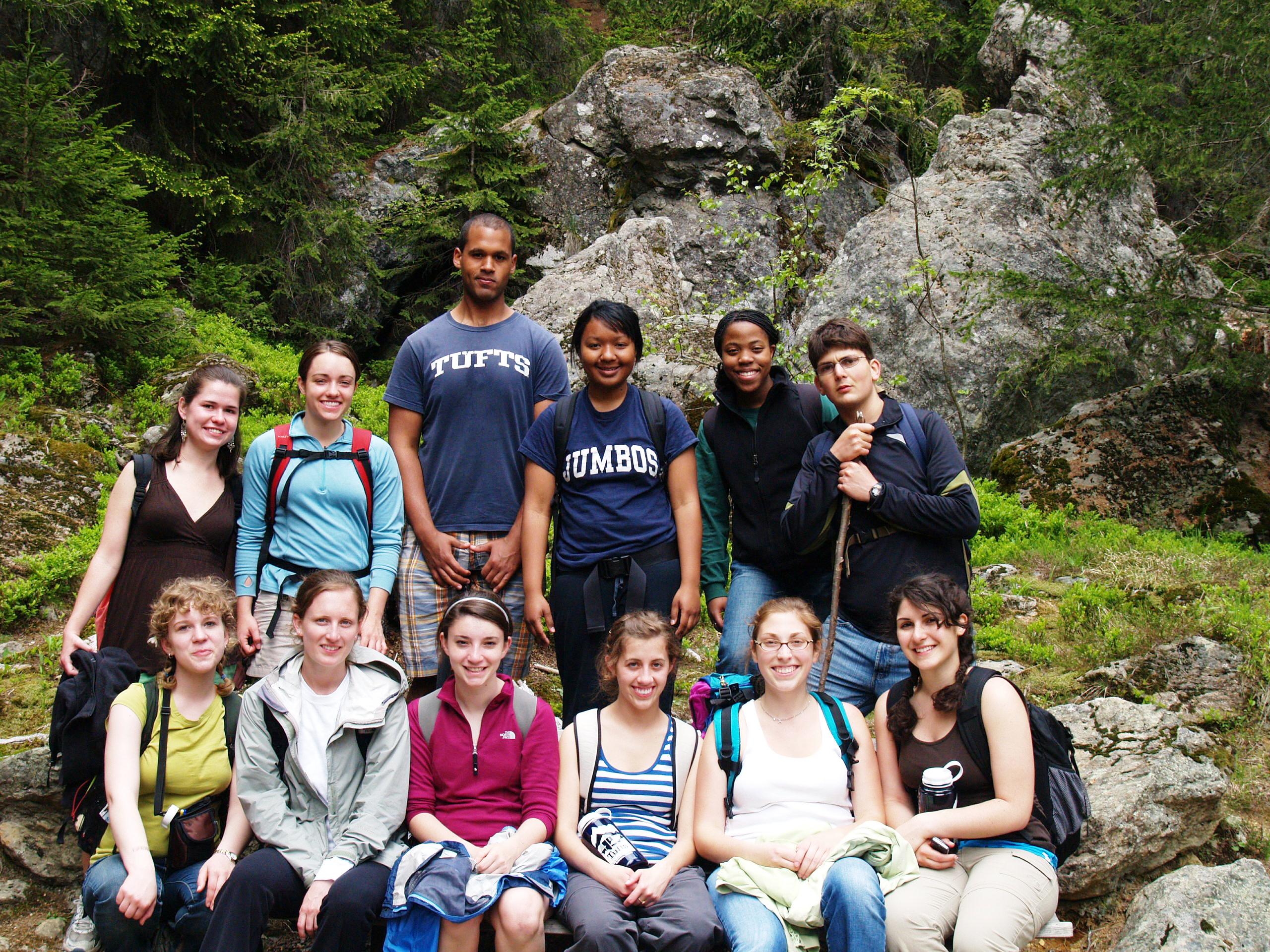 Students posing in two rows on a hike